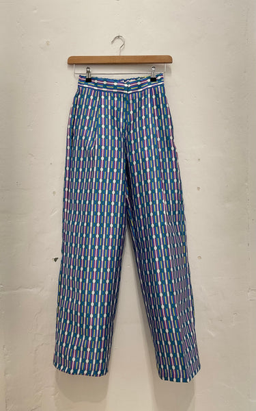 Geographic stripe pattern trousers